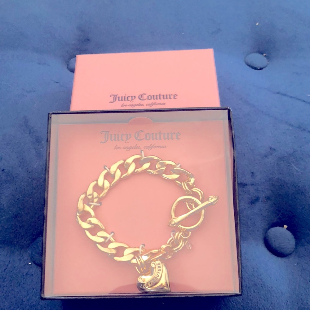 Juicy couture charm bracelet NEW. With box. Excellent condition.  Good for gift